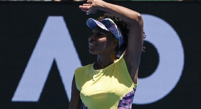 Venus Williams of the US celebrates after defeating Switzerland's Stefanie Voegele in their Australian Open second round match, in Melbourne, on January 18, 2017