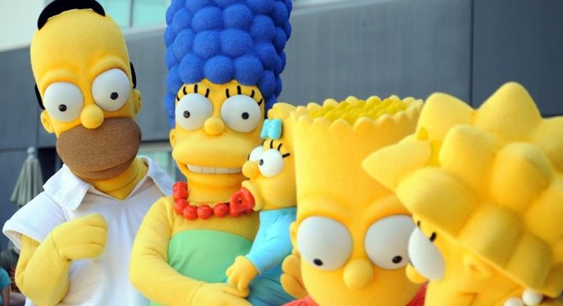 The Simpsons, consisting of Homer (2nd L), Marge, Maggie (C), Bart and Lisa (2nd R), will return for its 29th and 30th seasons, breaking the record for most episodes previously held by Western drama Gunsmoke