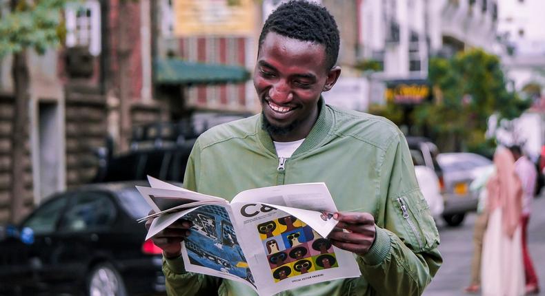 A photo of a man reading a booklet. Photo credits: Pixabay