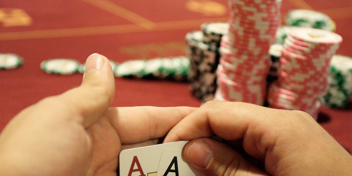 A player checks his cards during the finals of the Russian Masters Poker Cup.