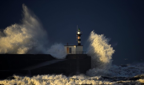 Huge waves crash on the San Esteban de Pravia seafront in the northern Spanish region of Asturias