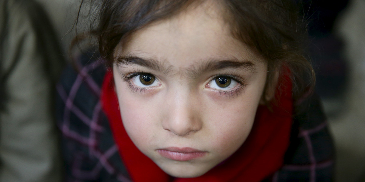 Gharam, 5, an orphan, attends a gathering organized by Damascus Lovers, a group that helps with social support for orphans, in Harasta, in the eastern Damascus suburb of Ghouta, Syria.