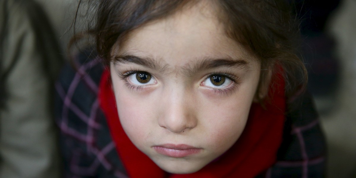 Gharam, 5, an orphan, attends a gathering organized by Damascus Lovers, a group that helps with social support for orphans, in Harasta, in the eastern Damascus suburb of Ghouta, Syria.