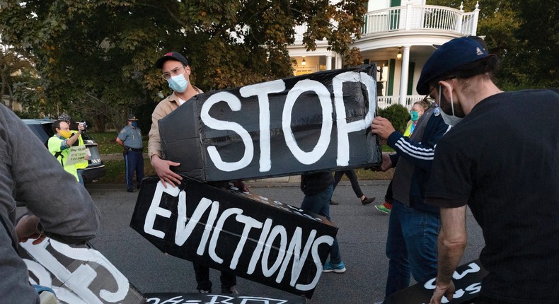 Housing activists erect a sign in front of Massachusetts Gov. Charlie Baker's house in Swampscott, Mass.
