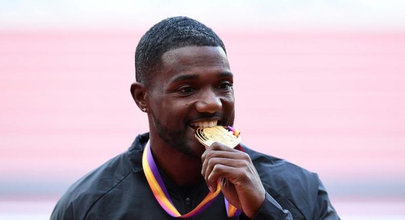 Justin Gatlin poses on the podium during the victory ceremony for the men's 100m at the 2017 IAAF World Championships in London on August 6, 2017