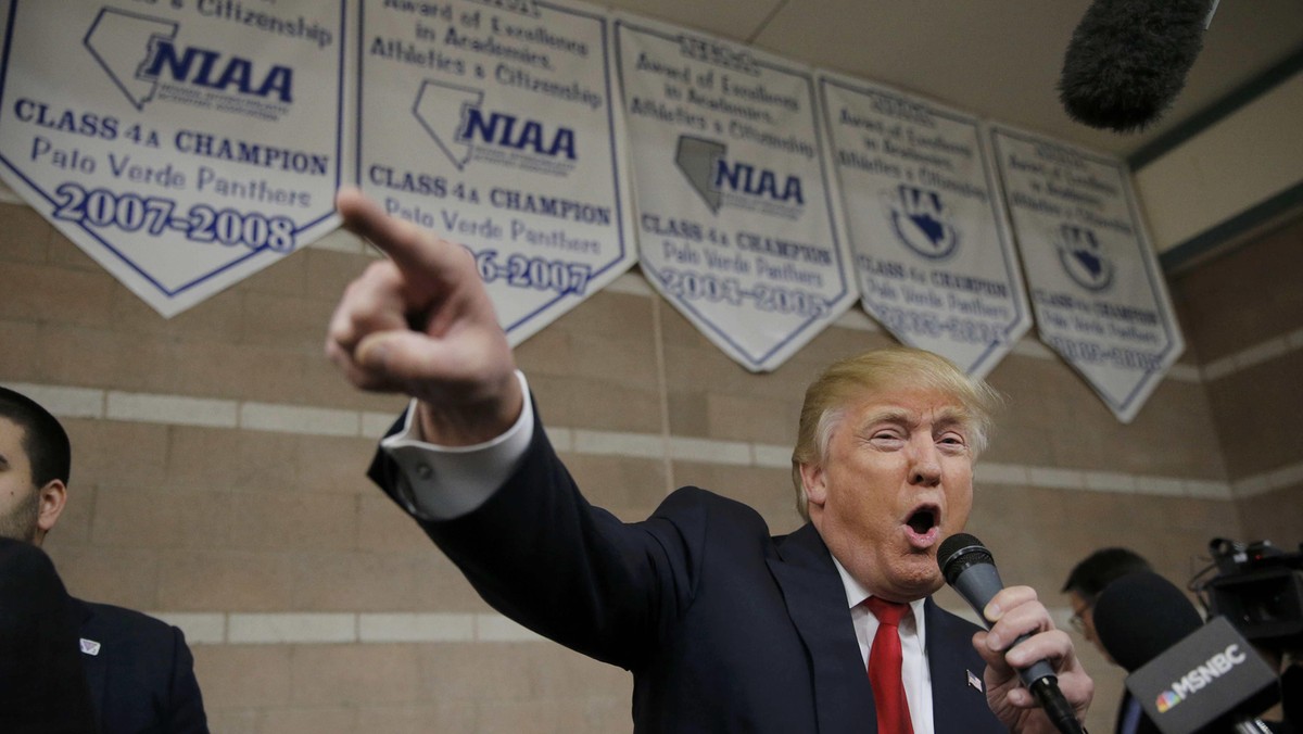 Republican U.S. presidential candidate Donald Trump addresses caucus goers as he visits a Nevada Rep