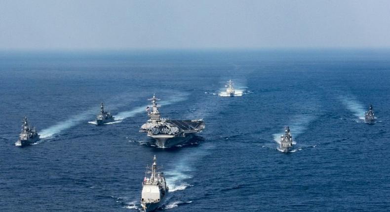 US President Donald Trump ordered a strike group headed by the USS Carl Vinson supercarrier (C) to the Korean peninsula in a show of force against North Korea's leader Kim Jong-Un.