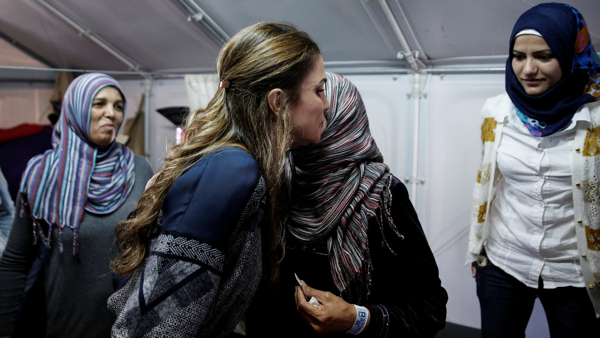Queen Rania of Jordan embraces a Syrian refugee woman during her visit at the Kara Tepe refugee camp on the island of Lesbos