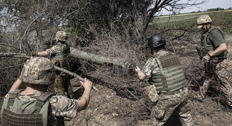 Ukrainian artillerymen in the military assembly center check their weapons before they head to the frontline in Kherson, Ukraine on July 15, 2022.