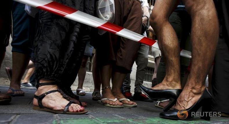 Men don stilettos, platforms for Madrid Gay Pride high heel race