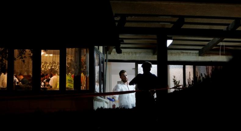 Israeli forensic police on July 22, 2017 inspect a home where a Palestinian broke in the day before and stabbed four Israelis, killing three of them, in the Jewish settlement Neve Tsuf in the occupied West Bank