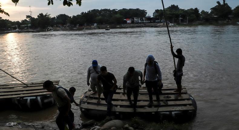 Central American migrants use a makeshift raft to illegally cross the Suchiate river from Tecun Uman, in Guatemala, to Ciudad Hidalgo, Mexico -- the US is trying to stem the flow of migrants towards the US border