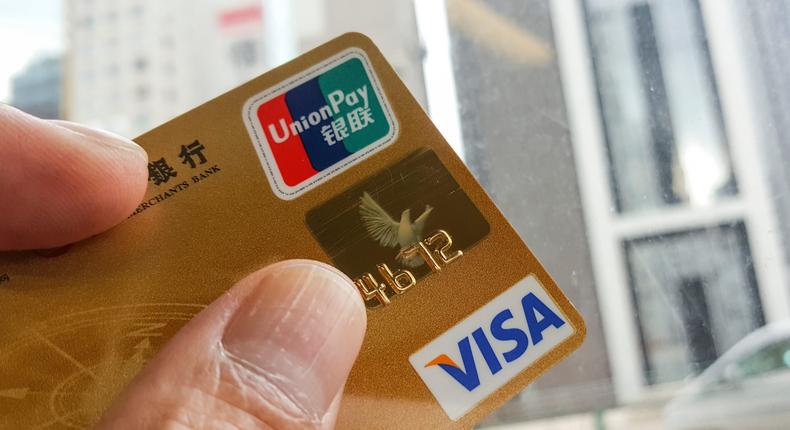 A credit card with UnionPay and VISA logos.
