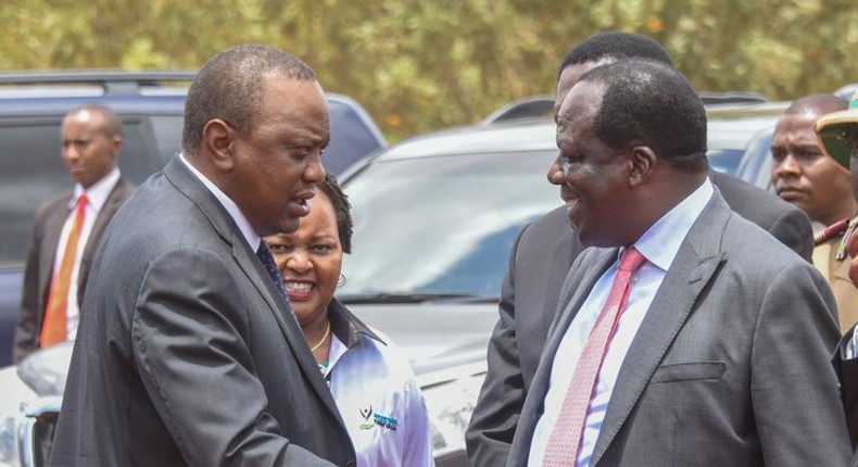 President Uhuru shakes hands with CoG Chair Wycliffe Oparanya when he arrived for the 2019 Devolution Conference in Kirinyaga County