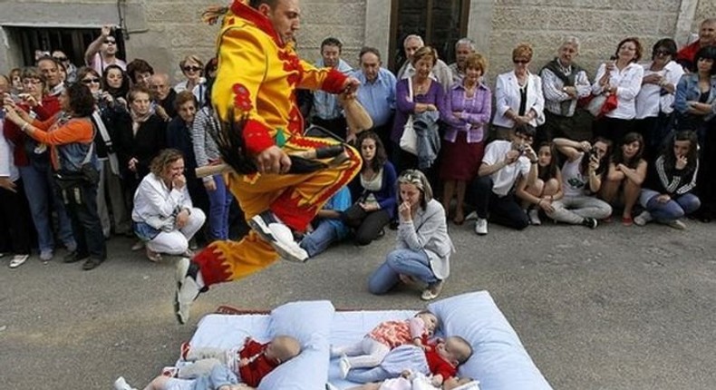 7 unusual cultures around the world/El Colacho Baby Jumping. [amusingplanet]