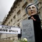 Protestor wearing a Theresa May mask is seen the day after Britain's election in London