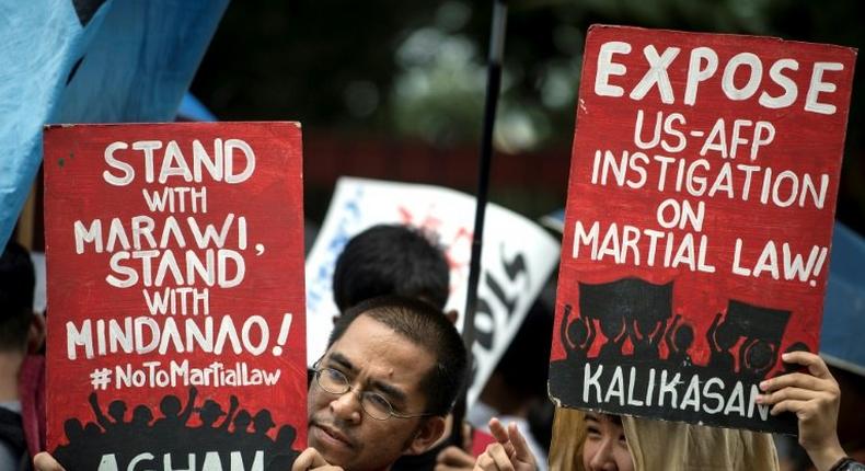 Activists protested against martial law while the debate was happening