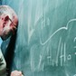 Portrait of a Frustrated Maths Lecturer Banging his Head Against a Blackboard