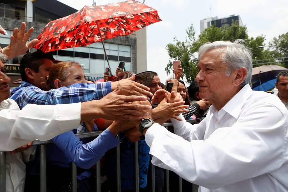 Andres Manuel Lopez Obrador, president of the National Regeneration Movement (MORENA) party, is greeted by supporters in Mexico City, June 26, 2016.