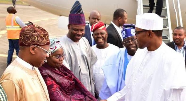 President Muhammadu Buhari in warm handshake with the Deputy Governor of Lagos State, Dr. (Mrs.) Idiat Oluranti Adebule at the Muritala Muhammed International Airport on Monday, February 1, 2016. They are flanked by: (L-R) Minister of Information and Culture, Alh. Lai Muhammed, Ogun State Governor, Senator Ibikunle Amosun, former Interim National Chairman of APC, Chief Bisi Akande and APC National Leader, Asiwaju Bola Ahmed.