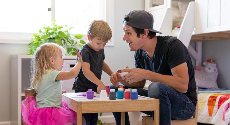 Taylor Calmus and his children finger painting.Courtesy of Taylor Calmus