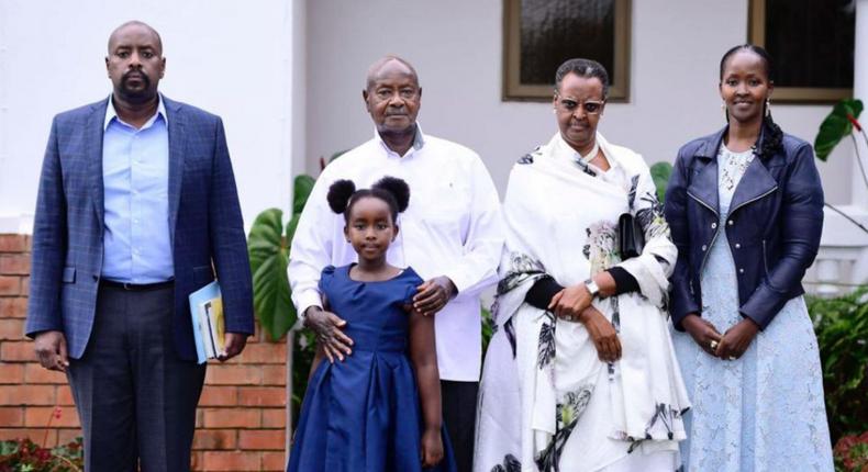 Gen Kainerugaba, President Museveni with his granddaughter, Janet and Charlotte