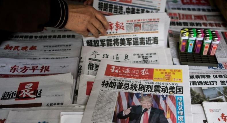 Chinese newspapers feature Donald Trump's victory in Shanghai on November 10, 2016