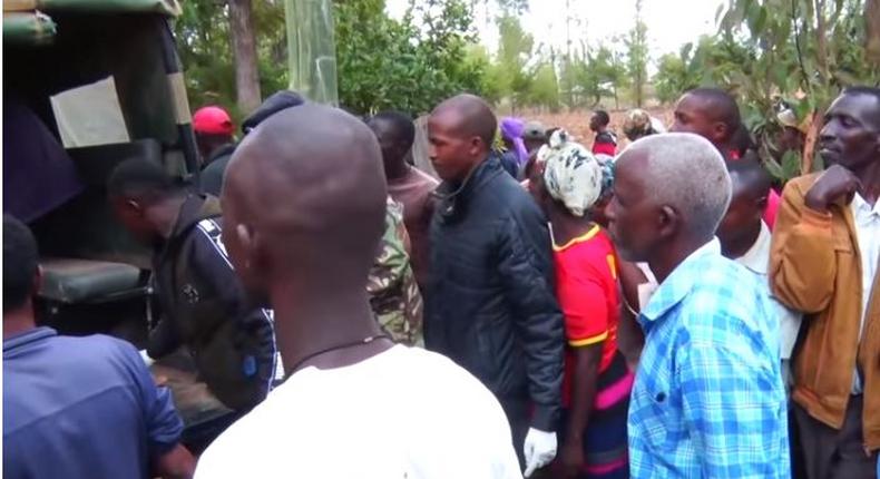 File image of police officers ferrying the body of a woman who was killed by her lover