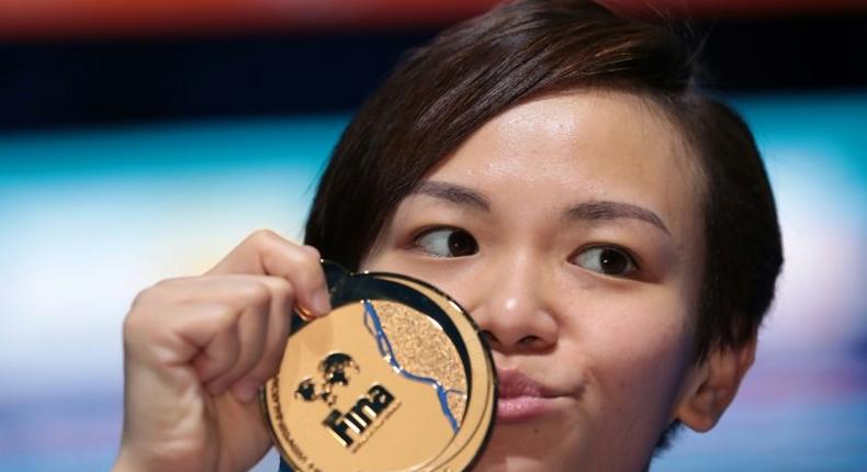 Malaysia's Cheong Jun Hoong poses with her gold medal during the podium ceremony for the women's 10m platform final during the diving competition at the 2017 FINA World Championships in Budapest, on July 19, 2017