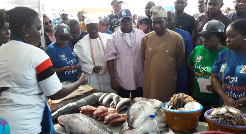 The Deputy Governor of Lagos State, Dr Obafemi Hamzat (3rd from right) and other top government officials taking a tour of fish stands at the 2019 Fish Festival in Lagos on Sunday. (NAN photo)