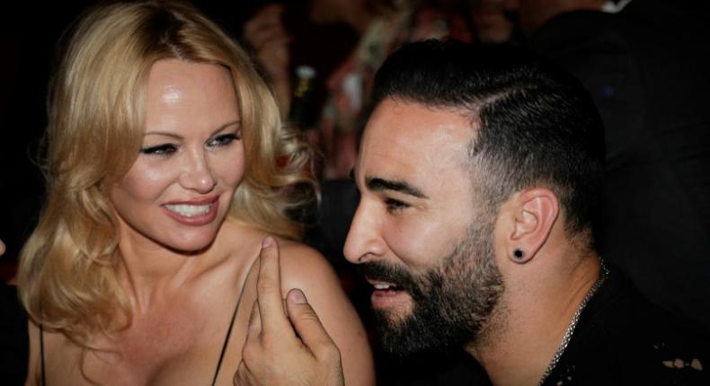 Pamela Anderson and France World Cup-winning player Adil Rami at the Crazy Horse cabaret in Paris on June 3