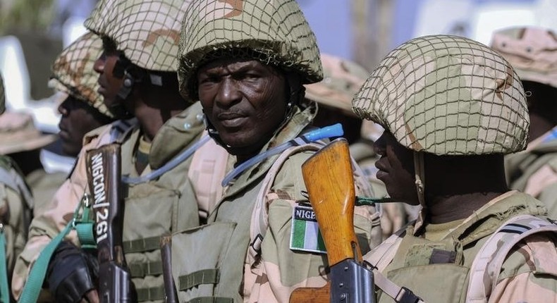 Nigerian Army soldiers stand as part of preparations for deployment to Mali, at the Nigerian Army peacekeeping centre in Jaji, near Kaduna January 17, 2013.  REUTERS/Afolabi Sotunde