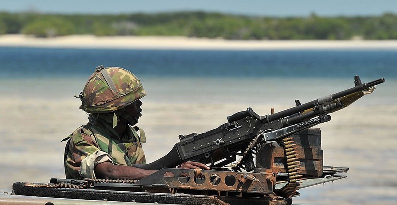 A Kenyan Defence Force soldier keeps lookout on the coast near Burgabo village, Southern Somalia on December 14, 2011. Burgabo is a Somalian port village which has been secured by Kenyan forces as they advance further up the Somali coastline in search of Al-Shabaab fighters. AFP PHOTO/Carl de Souza (Photo by CARL DE SOUZA/AFP via Getty Images)