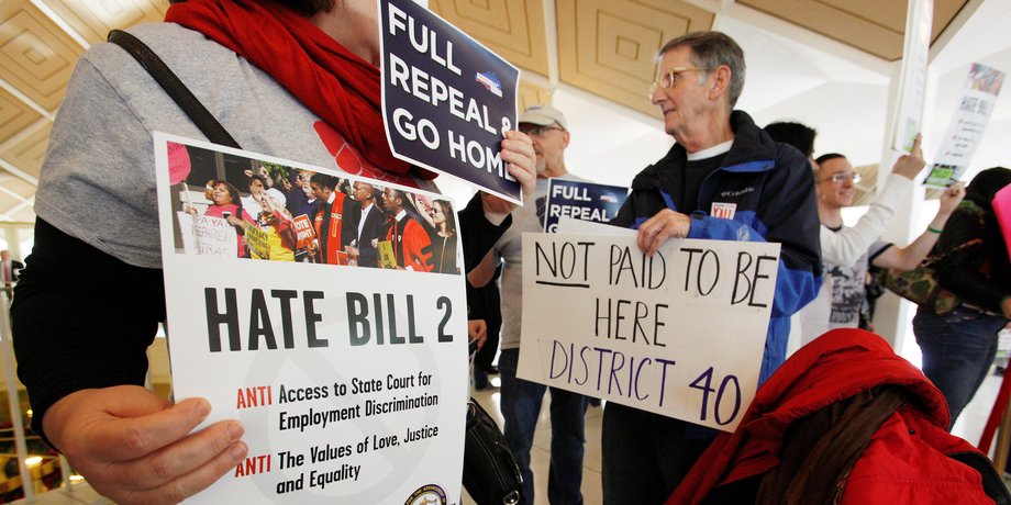 Opponents of North Carolina's HB2 law limiting bathroom access for transgender people protest in the gallery above the state's House of Representatives chamber as the legislature considers repealing the controversial law in Raleigh, North Carolina, U.S. on December 21, 2016.