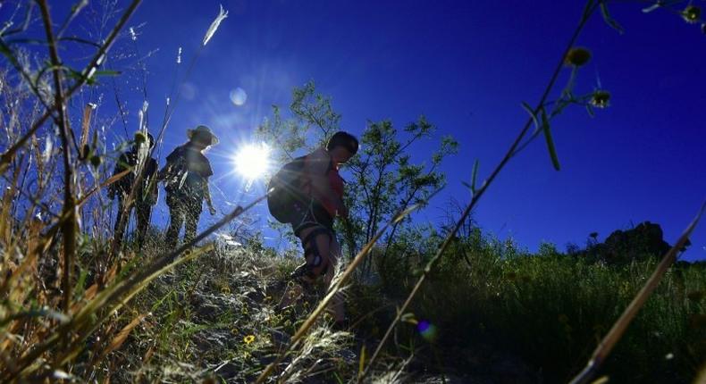 Volunteers hike into the borderlands of Arizona, and leave water behind for migrants as many die of dehydration or, in winter, hypothermia