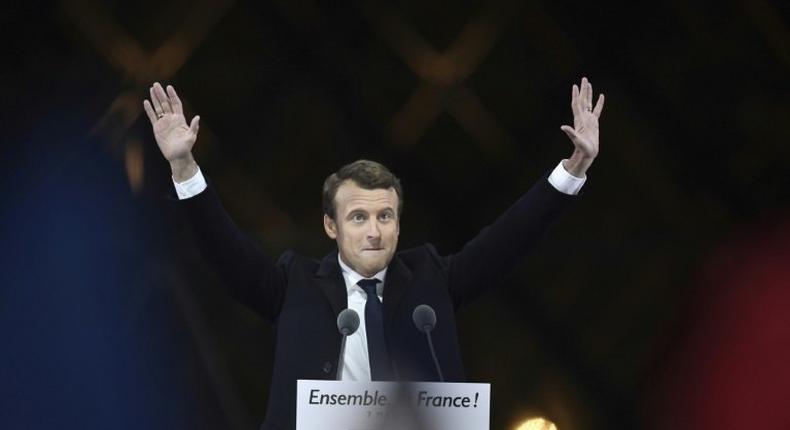 French president-elect Emmanuel Macron greets supporters during a post-election rally at the Louvre Museum in Paris, on May 7, 2017