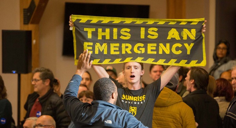 Climate change protesters disrupt candidate Joe Biden during a campaign event on October 9, 2019 in Manchester, New Hampshire.
