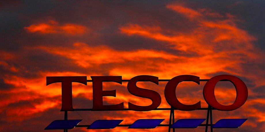 A company logo is pictured outside a Tesco supermarket in Altrincham northern England, April 16, 2016.