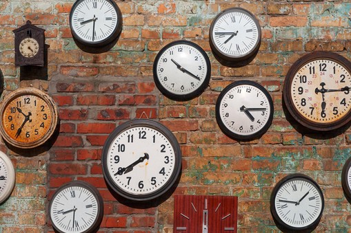 Hand with an old clock. Retro pocket watch