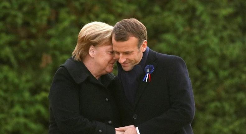 Germany is taking a softly-softly approach to French President Emmanuel Macron's easing of the budget strings to cope with protests, with Chancellor Angela Merkel (right) focussing on stability in Europe, analysts say