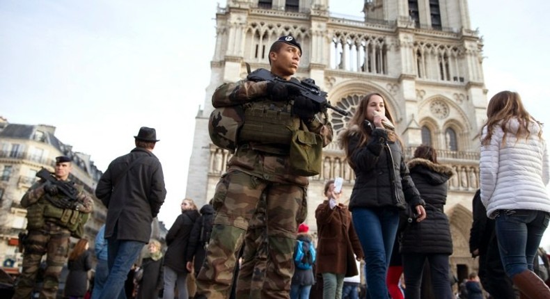 French soldiers patrol outside Notre Dame de Paris cathedral in December 2015