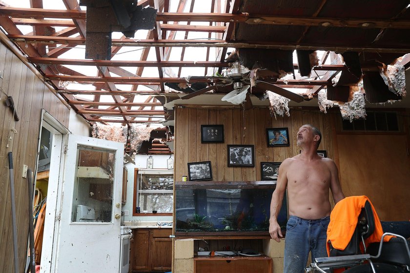 A man, who lost his home to Hurricane Harvey, is loaded into the back of an ambulance in Rockport, T