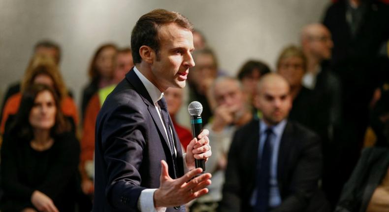 President Emmanuel Macron answering questions from residents during a surprise appearance at a debate in Bourg-de-Peage, southeast France, on Thursday