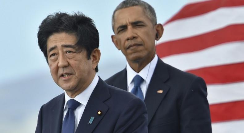 Japan's national broadcaster NHK provided live coverage of the joint addresses of Prime Minister Shinzo Abe (L) and US President Barak Obama