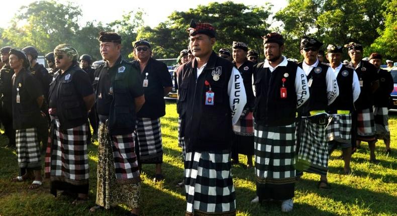 Balinese Hindu local security 'Pecalang' stand guard during a rehearsal ahead of the arrival of Saudi Arabia's King Salman bin Abdul-Aziz, in Nusa Dua, on March 3, 2017