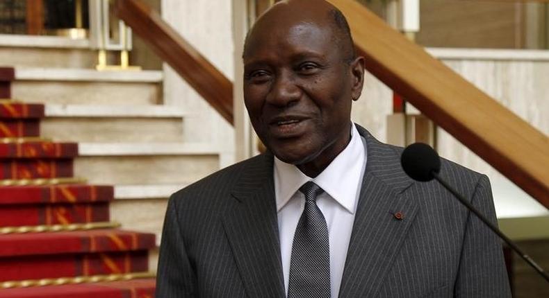 Ivory Coast Prime Minister Daniel Kablan Duncan smiles after the annoucement of the new government at the presidential palace in Abidjan January 12, 2016.  REUTERS/Luc Gnago