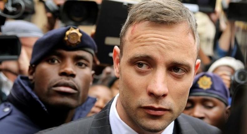 Olympic and Paralympic track star Oscar Pistorius leaves court after appearing for the 2013 killing of his girlfriend Reeva Steenkamp in the North Gauteng High Court in Pretoria, South Africa, June 14, 2016. 