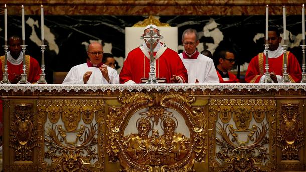 Pope Francis blesses the altar as he leads a Mass for cardinals and bishops who have passed away ove