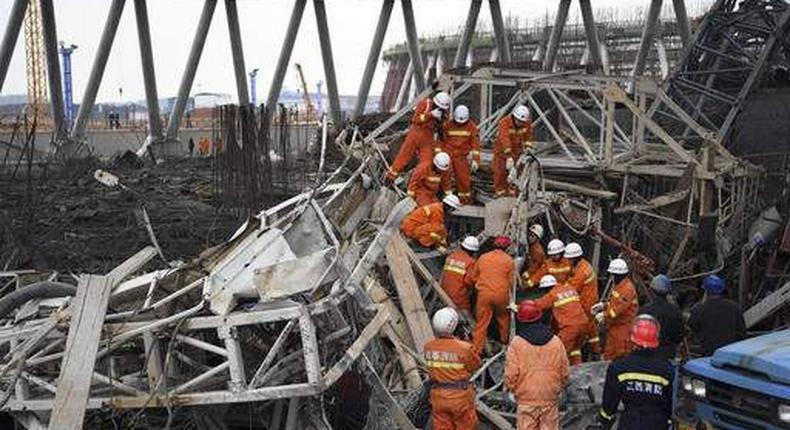 Rescue workers look for survivors after a work platform collapsed at the Fengcheng power plant in eastern China's Jiangxi Province.