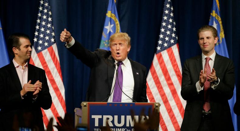 Republican presidential candidate Donald Trump, with his sons, Donald Trump Jr., left, and Eric, at a rally, February 23, 2016, in Las Vegas.